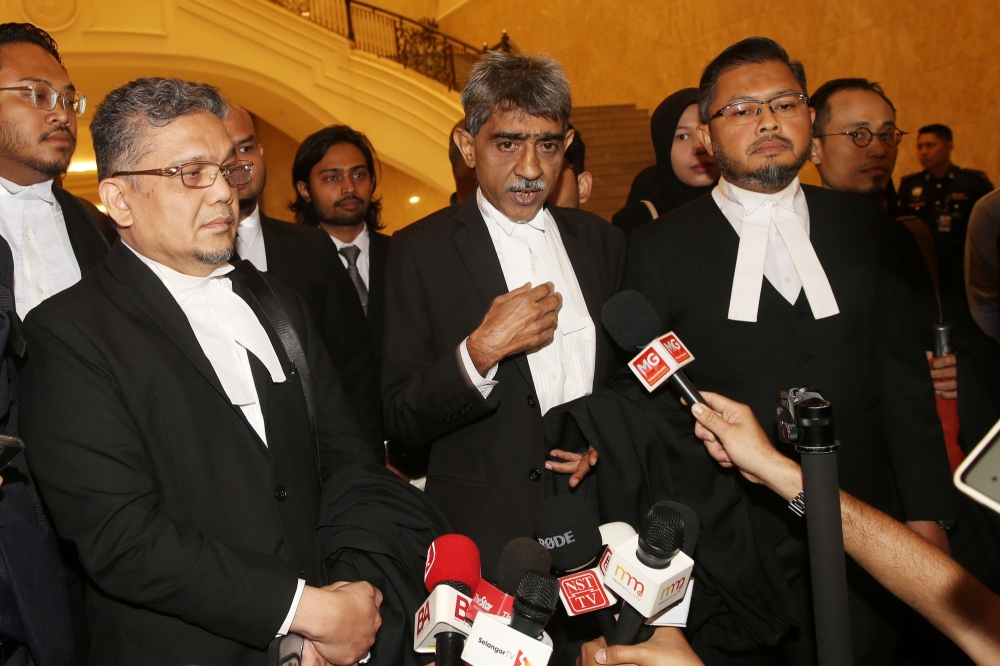 (From left to right) Lawyers Datuk Zainul Rijal Abu Bakar, Mohamed Haniff Khatri Abdulla, and Yusfarizal Yussoff speak to the media after the Federal Court ruling on SIS’s appeal against the 2014 Selangor fatwa, in Putrajaya, June 19, 2025. — Picture by Choo Choy May